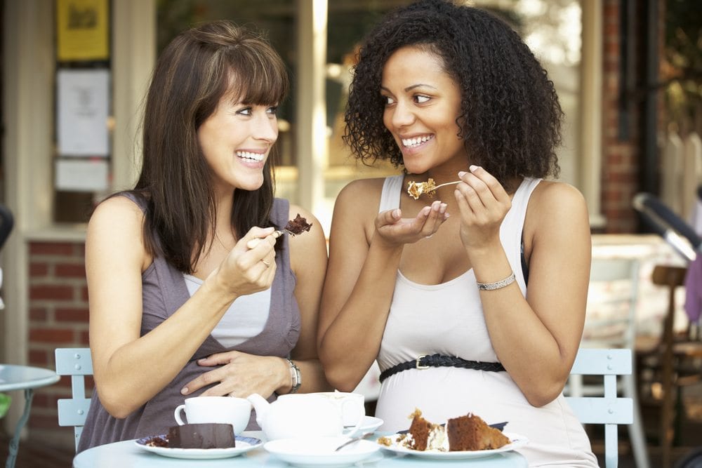 Two friends enjoy desert at Tulepo Honey on Main St. in Greenville, SC.