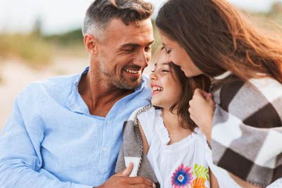 smiling family outdoors