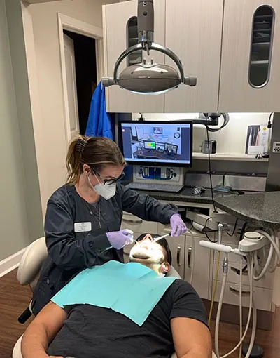 Dr. Goldston treating a patient for gum disease at Greenville Family Smiles in Greenville, SC